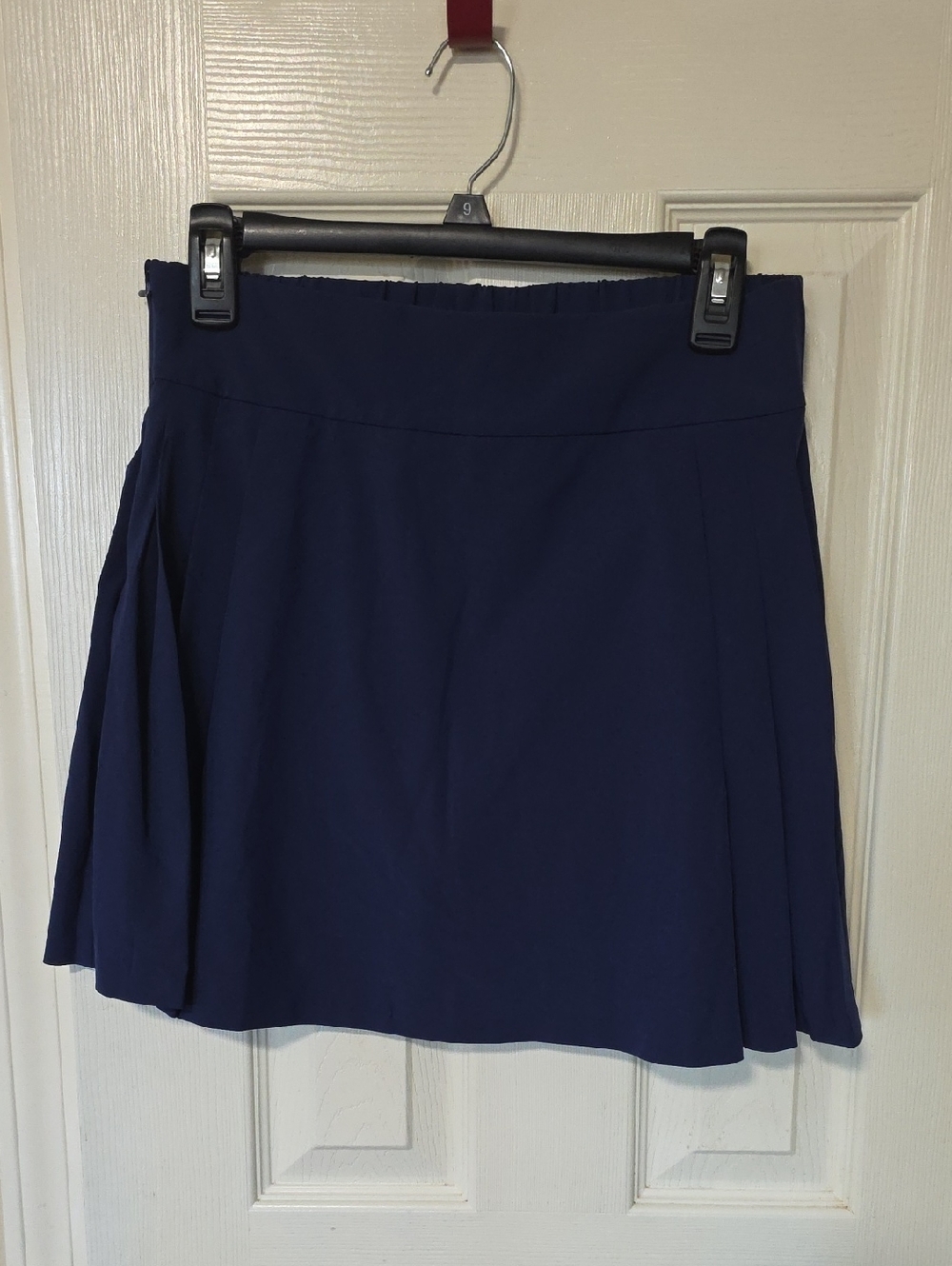 The Drop Skort, With Zipper Navy Blue Featuring Pockets.